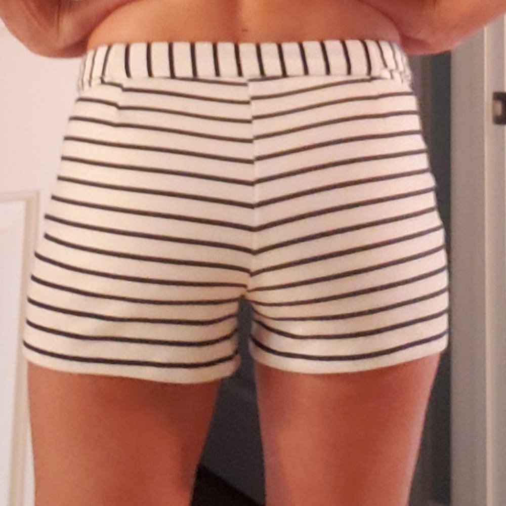 Blue and white striped shorts with silver grommet details on waist. Size S.
